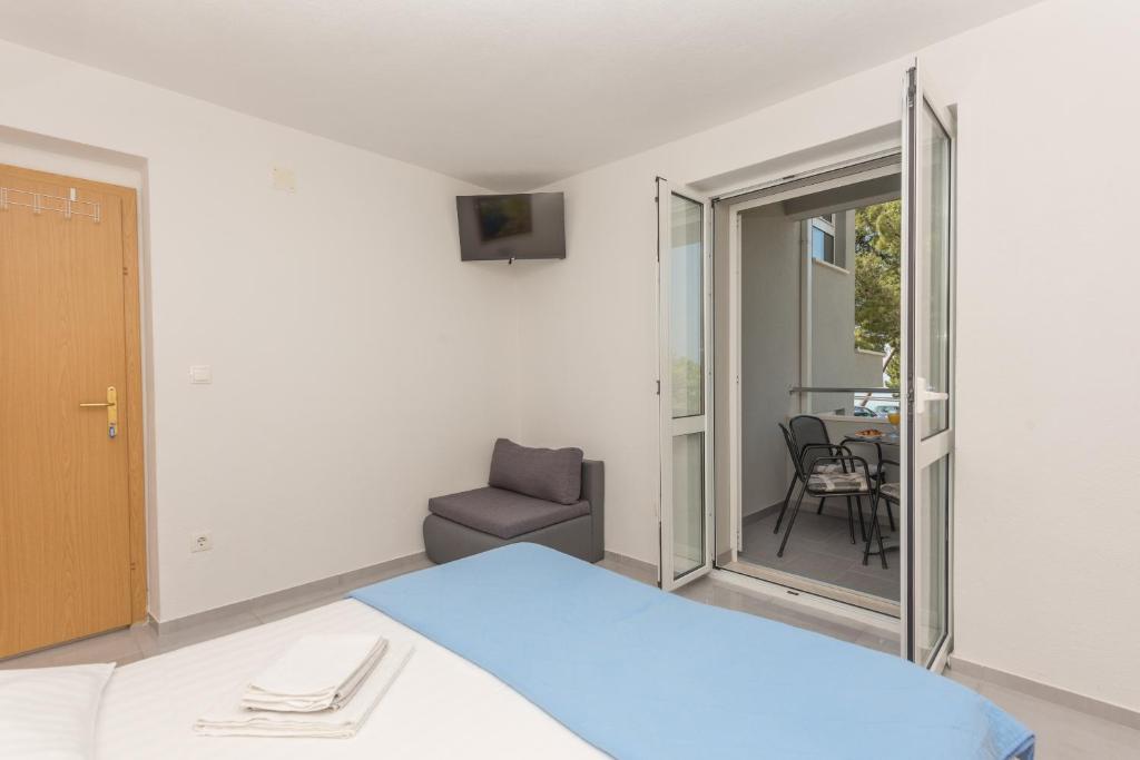 Posteľ alebo postele v izbe v ubytovaní Apartments M&A