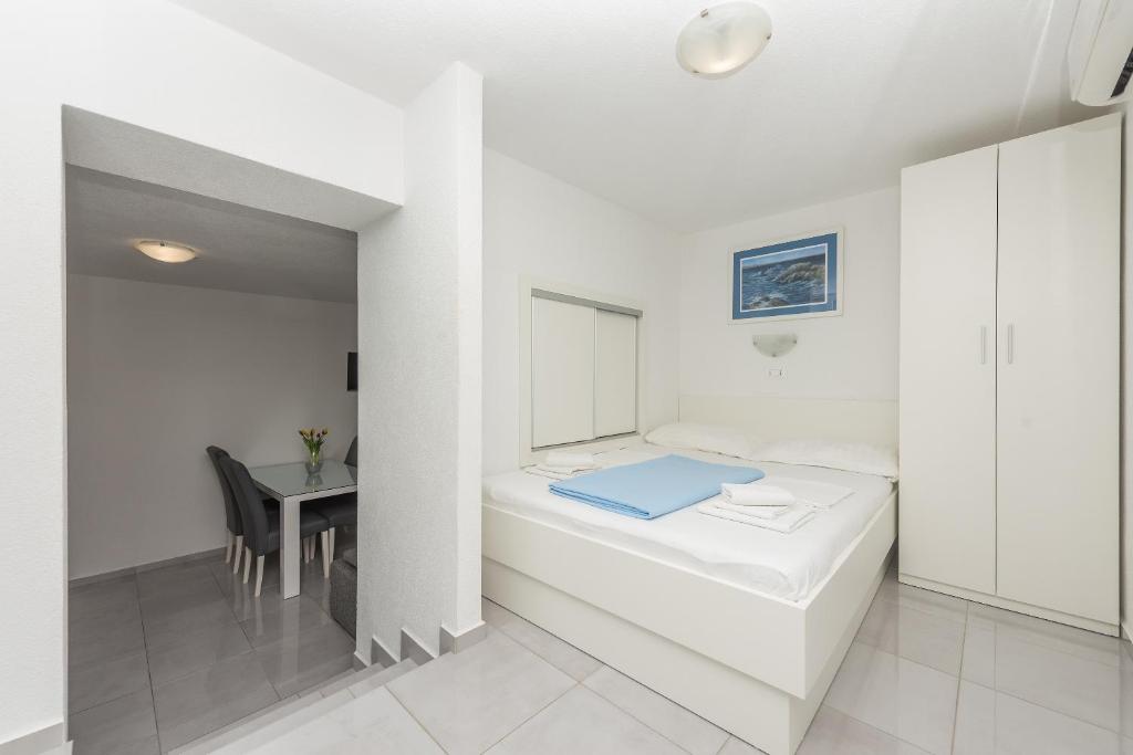 Posteľ alebo postele v izbe v ubytovaní Apartments M&A