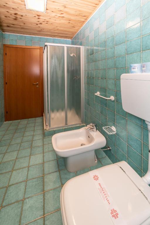 Koupelna v ubytování Hotel Gran Baita