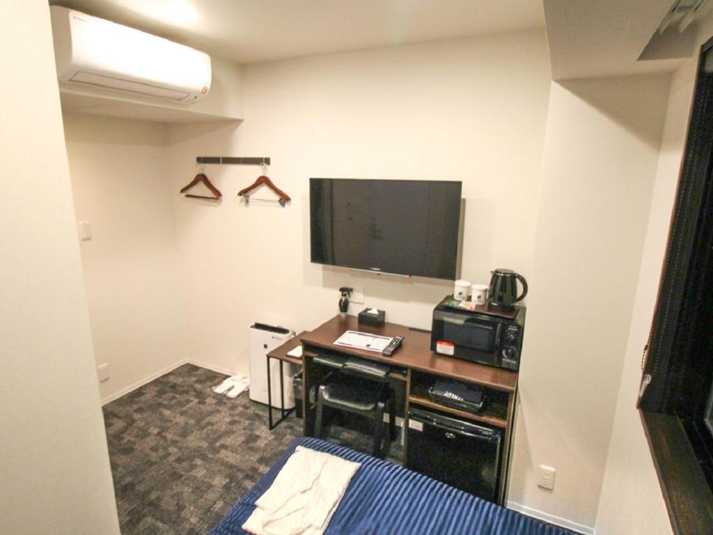 TV a/nebo společenská místnost v ubytování HOTEL LiVEMAX Nagoya Kanayama