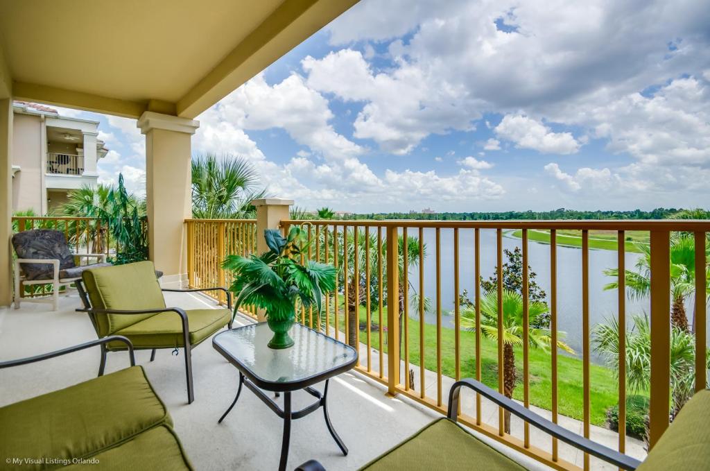 a balcony with a view of the water at LAKEVIEW Condo at Vista Cay Resort in Orlando