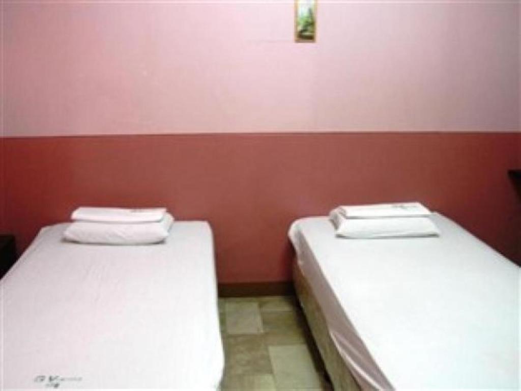 Postel nebo postele na pokoji v ubytování GV Hotel - Cagayan de Oro