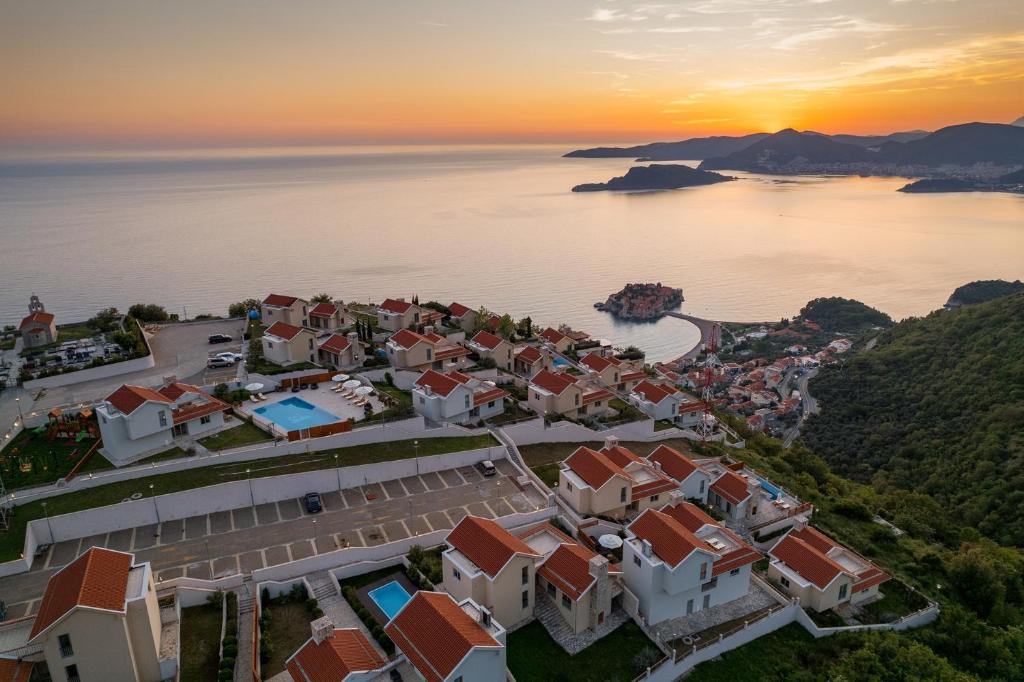 an aerial view of a town next to the water at Carsko Selo Blizikuce in Budva