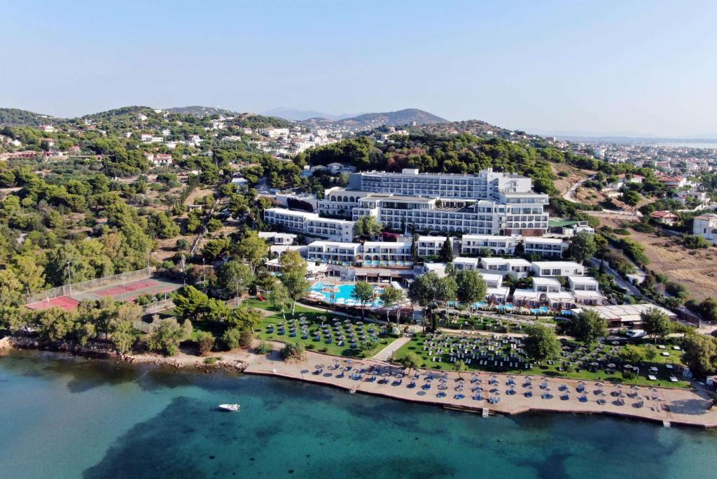 an aerial view of a resort on the water at Dolce by Wyndham Athens Attica Riviera in Vravrona