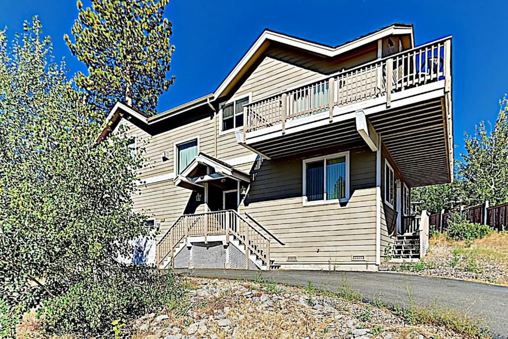 a wooden house with a balcony on the side of it at Mountain-View Eden in South Lake Tahoe