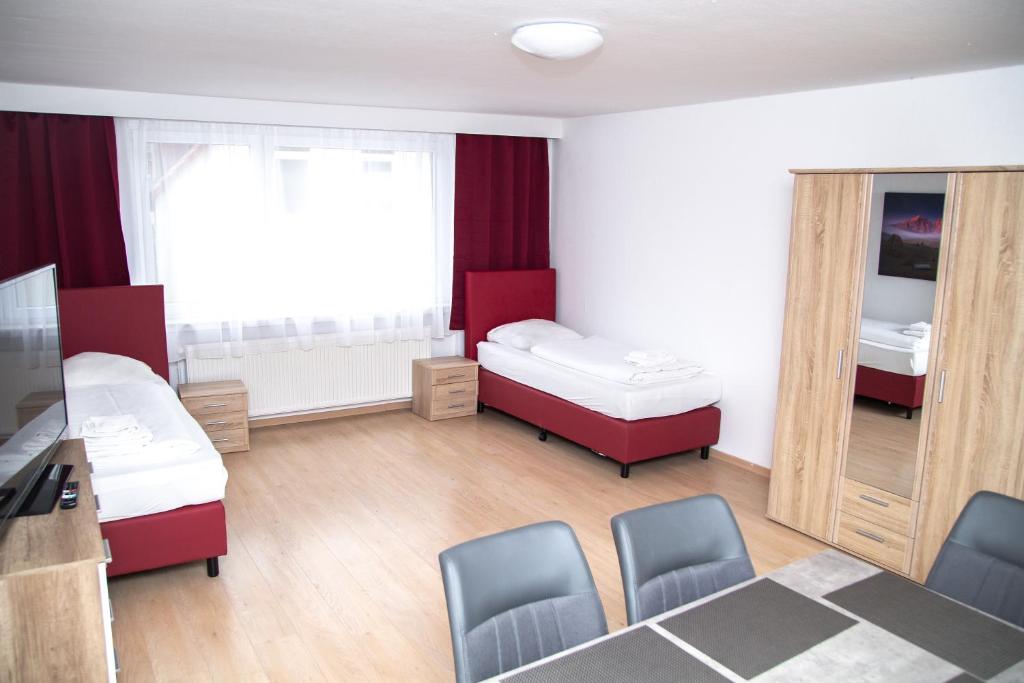 Llit o llits en una habitació de Othman Appartements Anderter Straße 55g