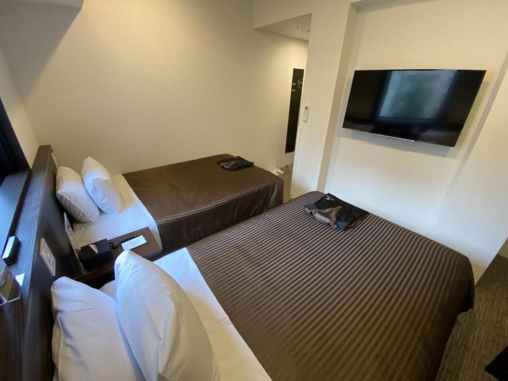 TV a/nebo společenská místnost v ubytování HOTEL LiVEMAX PREMIUM Nagoya Marunouchi