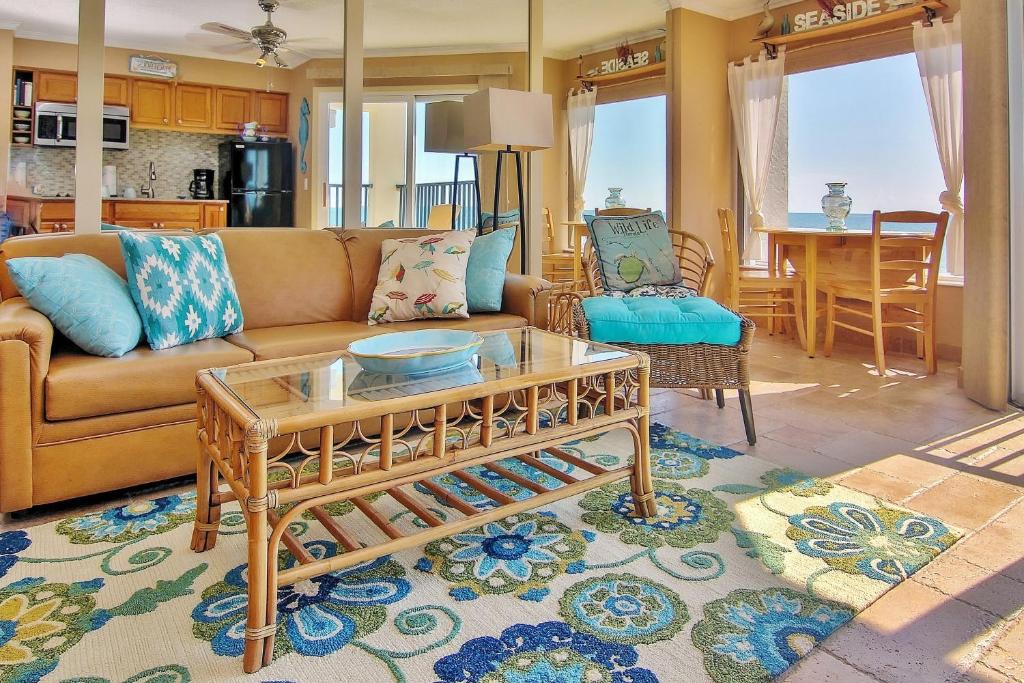 a living room with a couch and a table at Belleair Beach Club 315 in Clearwater Beach