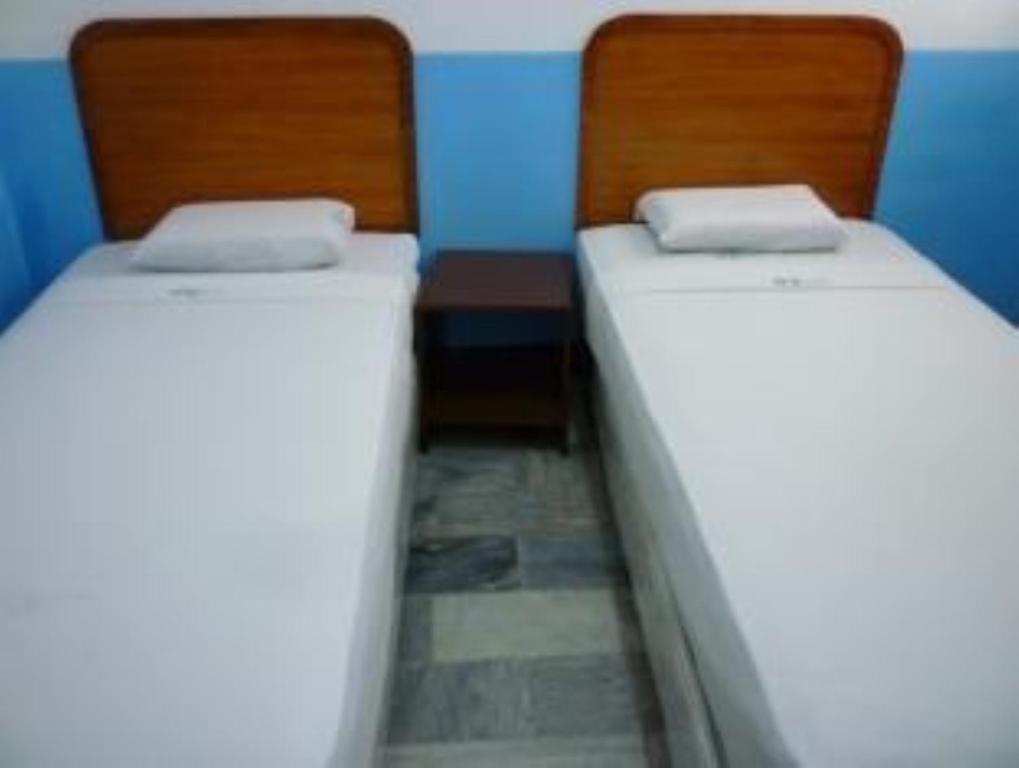 Postel nebo postele na pokoji v ubytování GV Hotel - Davao