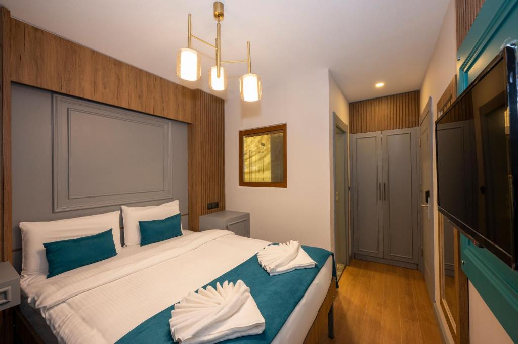 Ένα ή περισσότερα κρεβάτια σε δωμάτιο στο Lynda Hotel