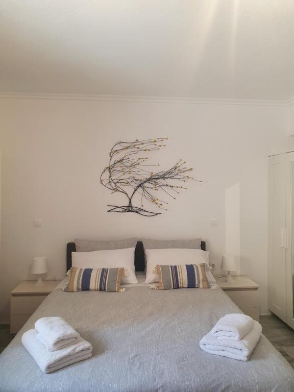 Posteľ alebo postele v izbe v ubytovaní Kalamia's cozy apartment