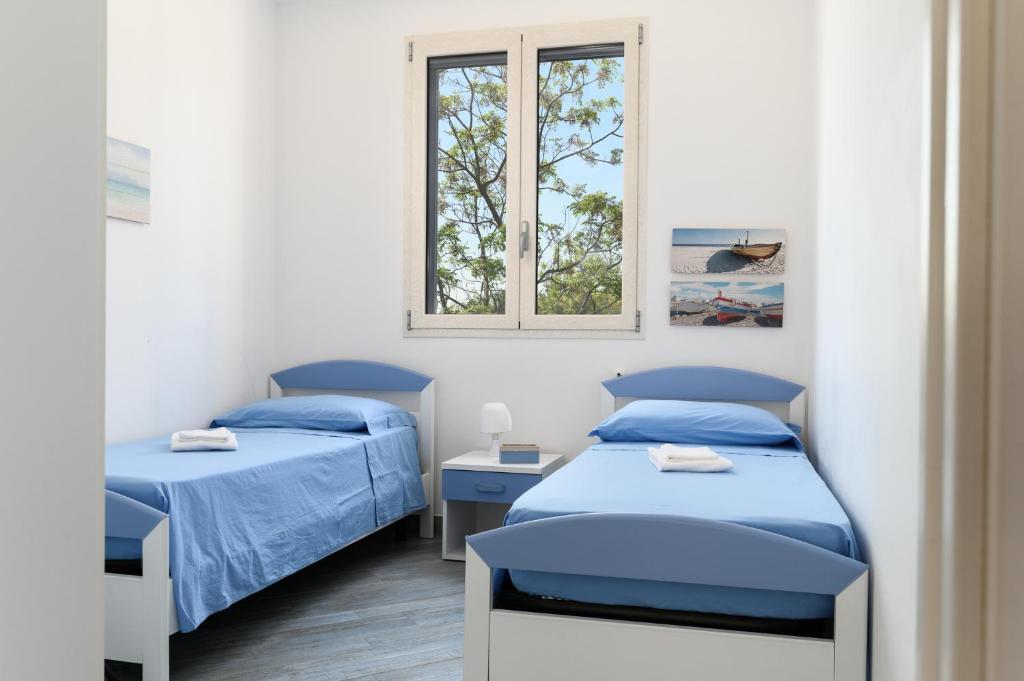Postel nebo postele na pokoji v ubytování Casa Maiolica