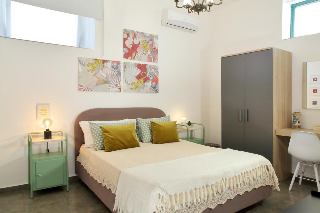Postel nebo postele na pokoji v ubytování B&B RONCO ZAFFARANA