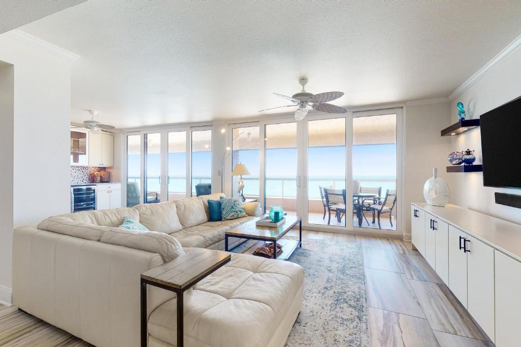 a living room with a couch and a table at Crescent Beach Club II PHB in Clearwater Beach