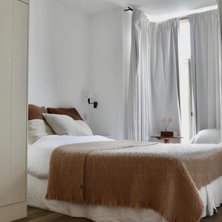 Postel nebo postele na pokoji v ubytování Boetiekhotel Hemelhuys