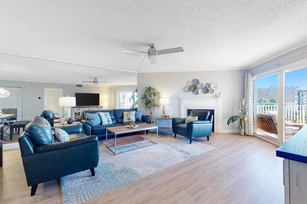 a living room with a couch and a table at Beach Cottage 1405 in Clearwater Beach
