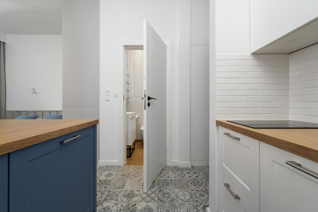 Kuchyňa alebo kuchynka v ubytovaní Old Town Studio by Noclegi Renters