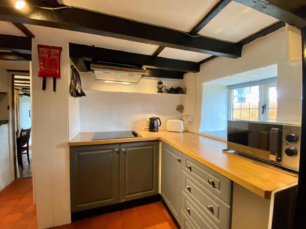 Kuchyň nebo kuchyňský kout v ubytování Hendy Cottage