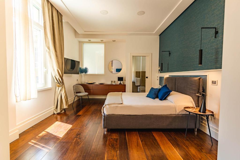 Postel nebo postele na pokoji v ubytování AD MAIORA Boutique Suite
