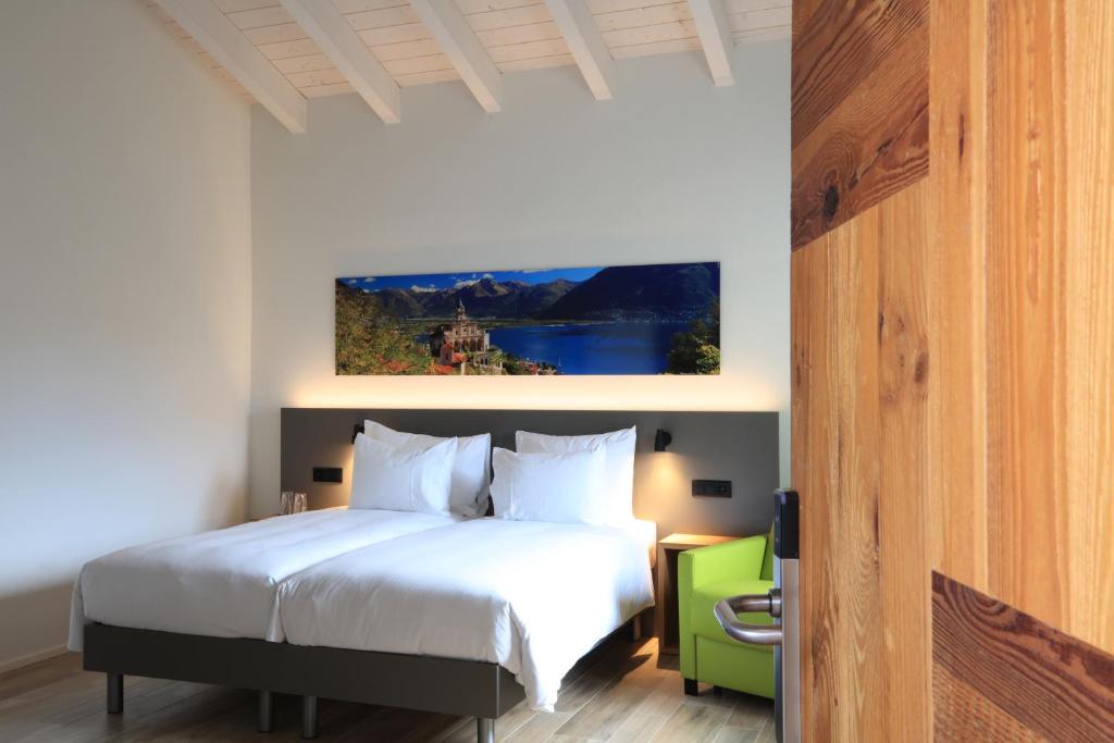 Postel nebo postele na pokoji v ubytování Charme Hotel al Torchio