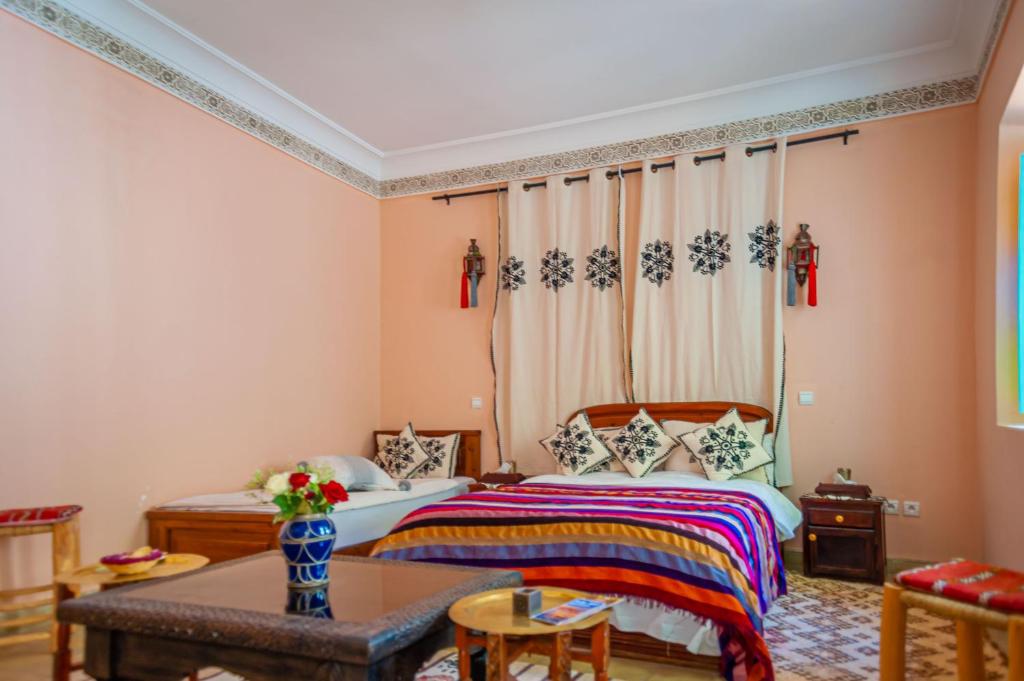 Postel nebo postele na pokoji v ubytování Riad Dar Mamouni