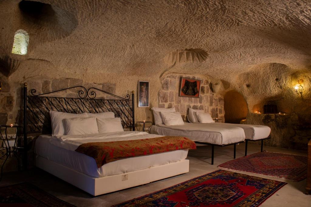 Cave Art Hotel Cappadocia 객실 침대