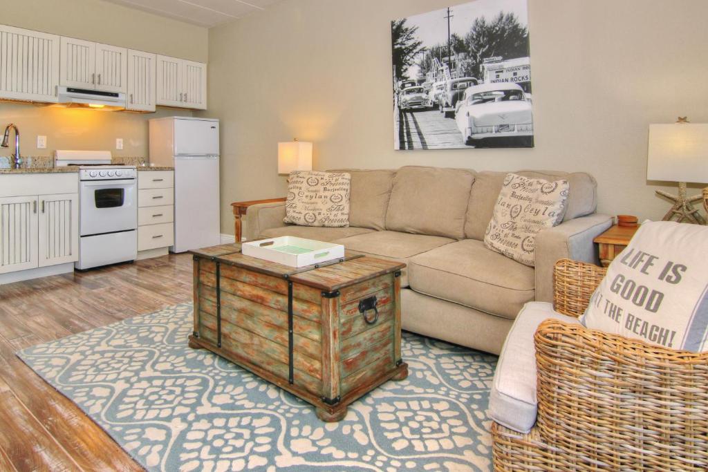 a living room with a couch and a table at Bungalow Beach Place 2 in Clearwater Beach