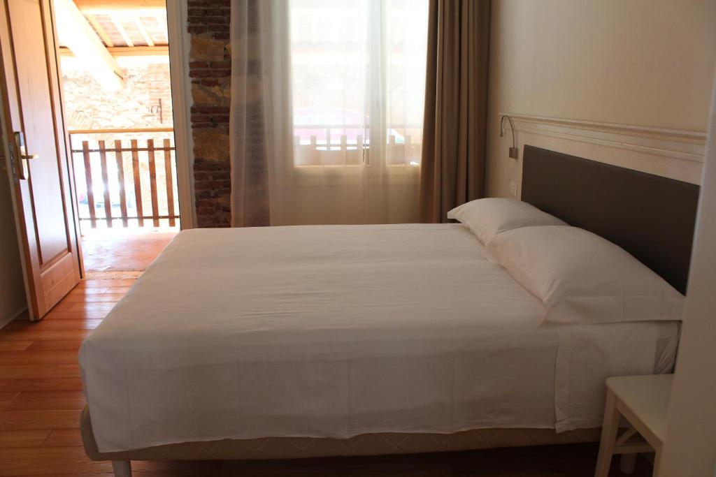 Postel nebo postele na pokoji v ubytování Hotel Albergo al Sole