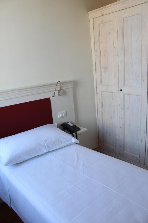 Postel nebo postele na pokoji v ubytování Hotel Albergo al Sole