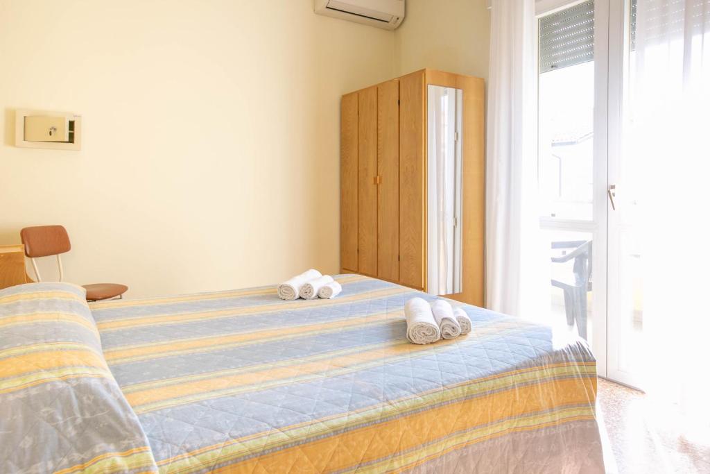 Postel nebo postele na pokoji v ubytování Hotel Ischia