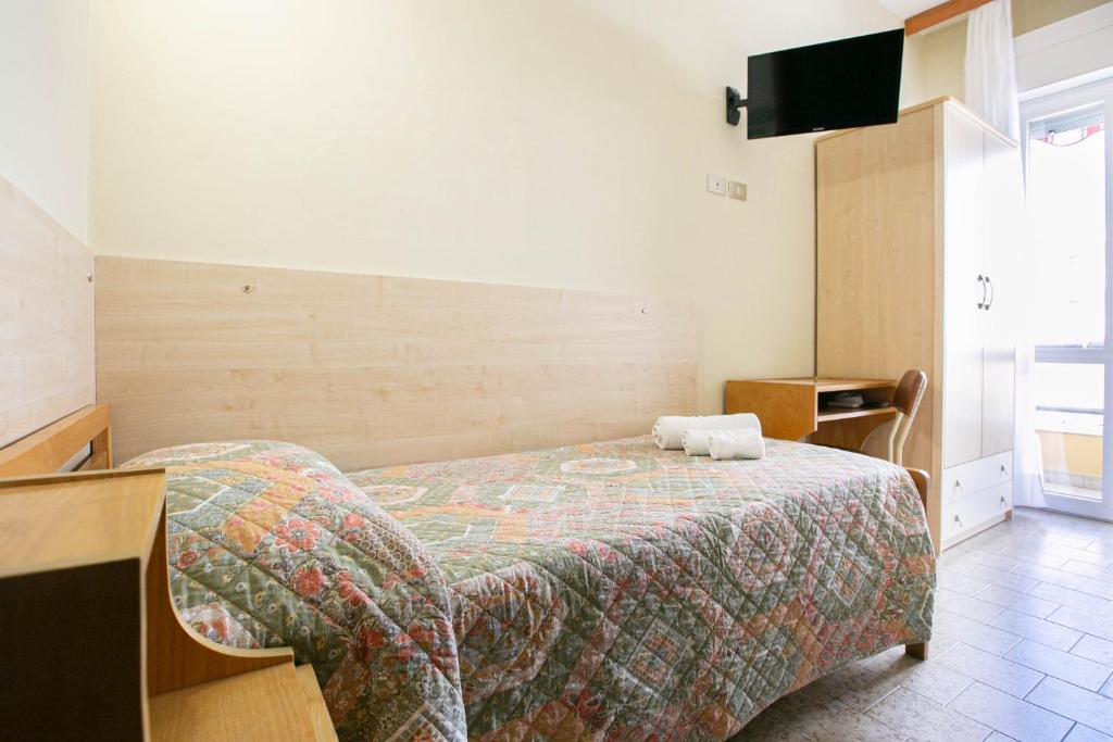 Postel nebo postele na pokoji v ubytování Hotel Ischia