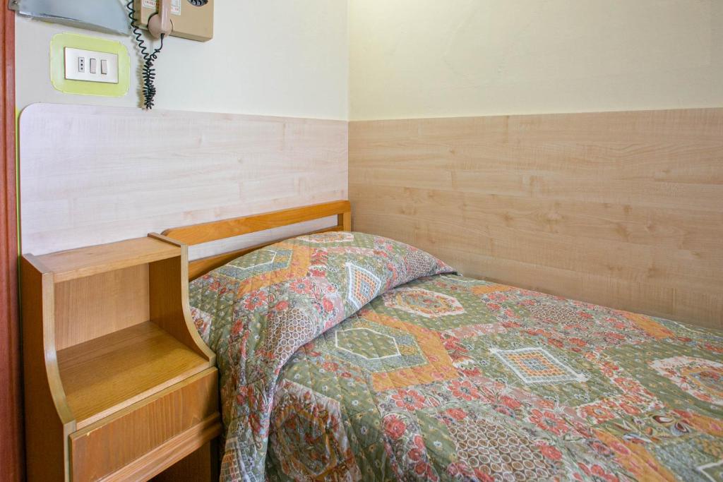 Postel nebo postele na pokoji v ubytování Hotel Ischia