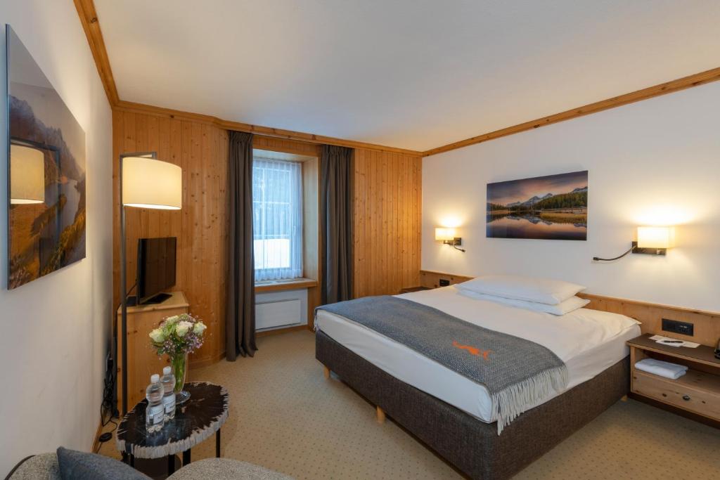 Postel nebo postele na pokoji v ubytování Edelweiss Swiss Quality Hotel