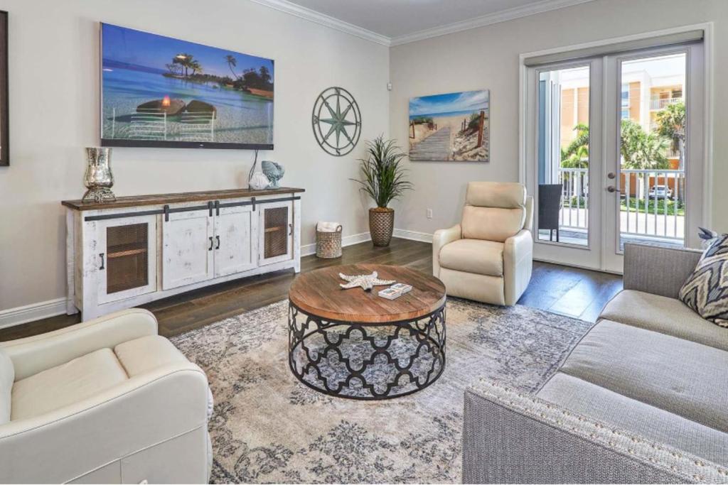 a living room with a couch and a table at Redington Beach Villas 313 in St. Pete Beach