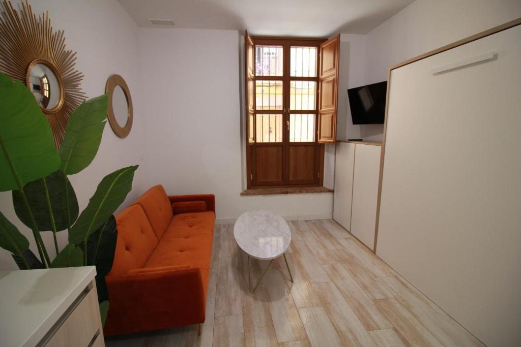 TV a/nebo společenská místnost v ubytování GLORIA SUITES