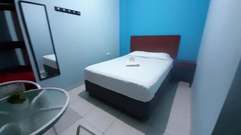 Postel nebo postele na pokoji v ubytování AYPA Hostal