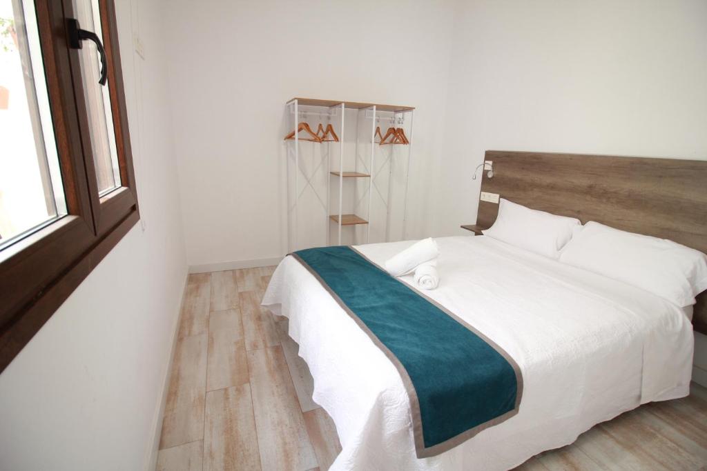 Postel nebo postele na pokoji v ubytování GLORIA SUITES