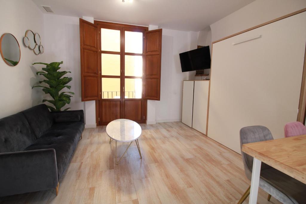 TV a/nebo společenská místnost v ubytování GLORIA SUITES