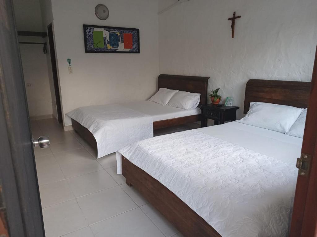 Postel nebo postele na pokoji v ubytování Hotel Villa Maritza
