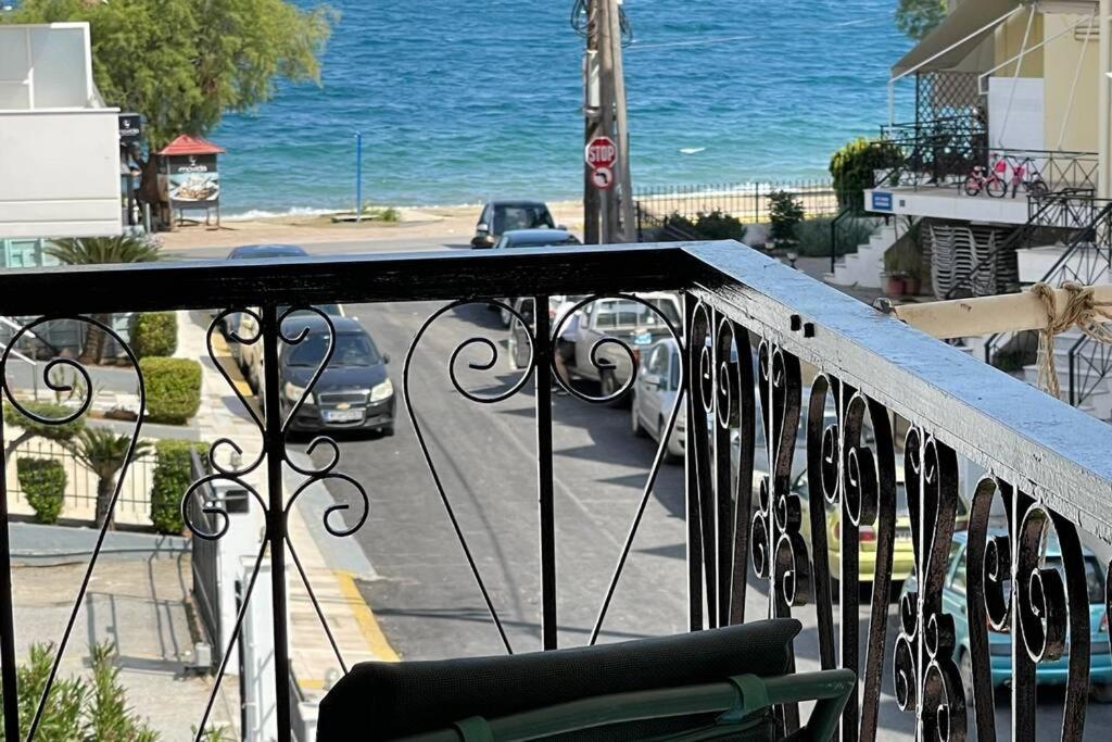 a balcony with a view of a street and the ocean at DM home (sea view apartment) in Lefkandi Chalkidas