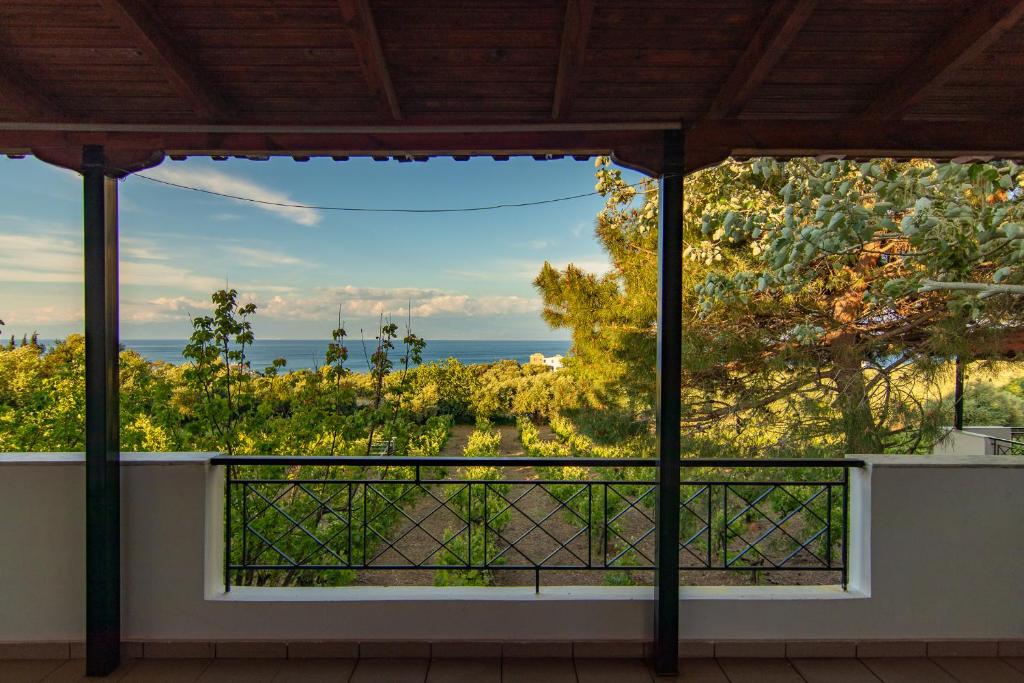 a view of the ocean from the balcony of a house at Anastasia Apartments in Koroni