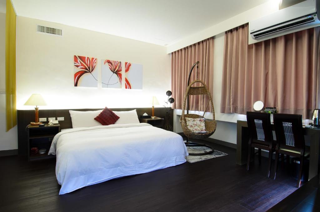Postel nebo postele na pokoji v ubytování Yuh-Tarng Hotel