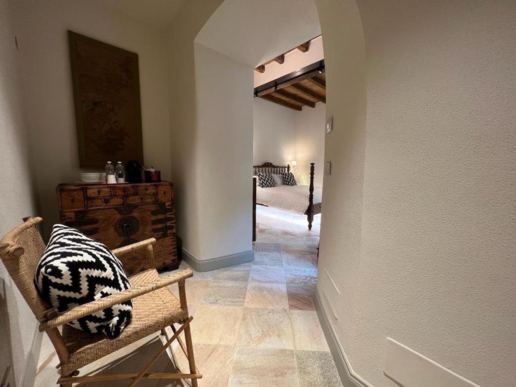 A bed or beds in a room at Palazzo Balbo di Vinadio Apartments