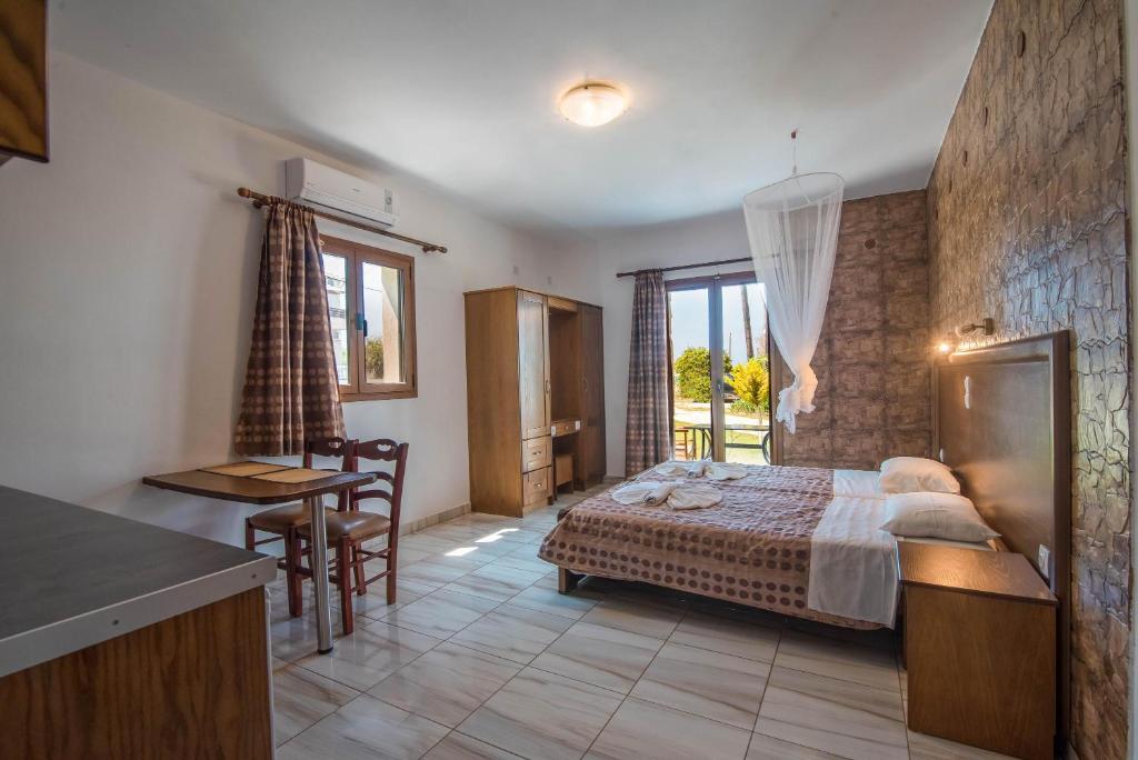 A bed or beds in a room at Mirage Arillas Studio Type B11