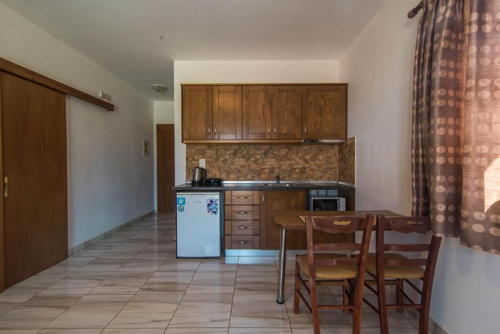 A kitchen or kitchenette at Mirage Arillas Studio Type B11