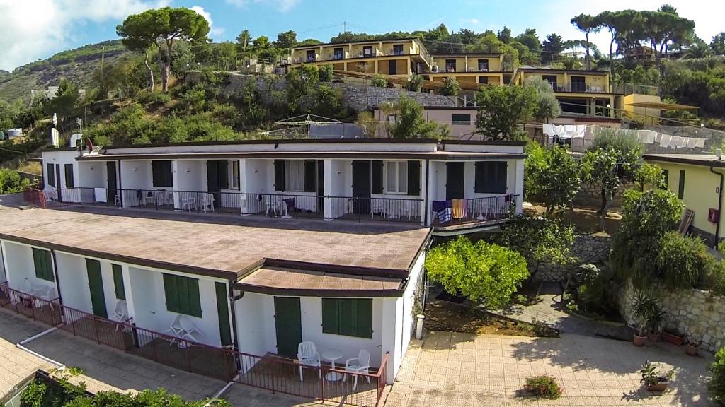 an aerial view of a house with a hill in the background at Hotel Dino in Capoliveri