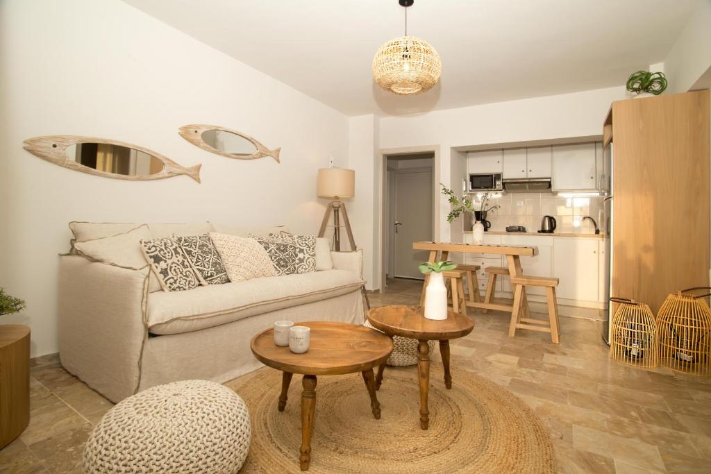 a living room with a couch and a table at Horizon Hotel Kalymnos in Myrties