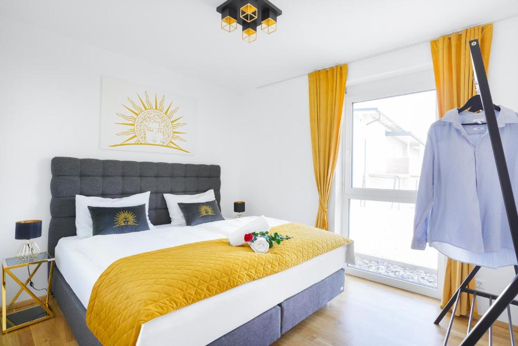 Posteľ alebo postele v izbe v ubytovaní CT-GOLD Apartments - Villach Malina - nahe Atrio und Therme