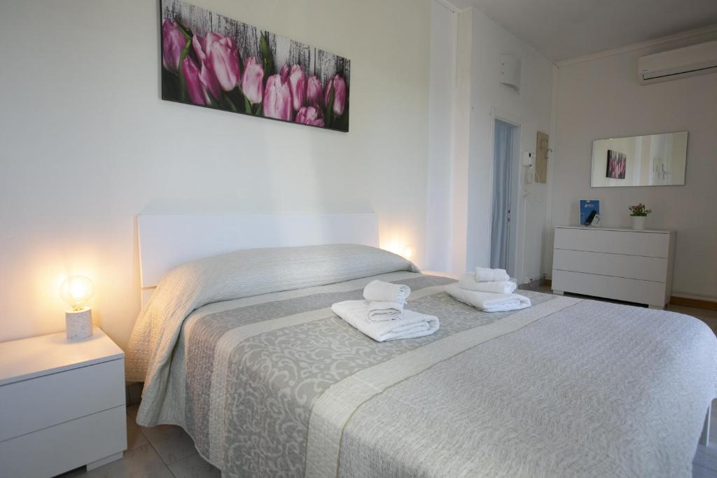 Postel nebo postele na pokoji v ubytování Hotel Mara