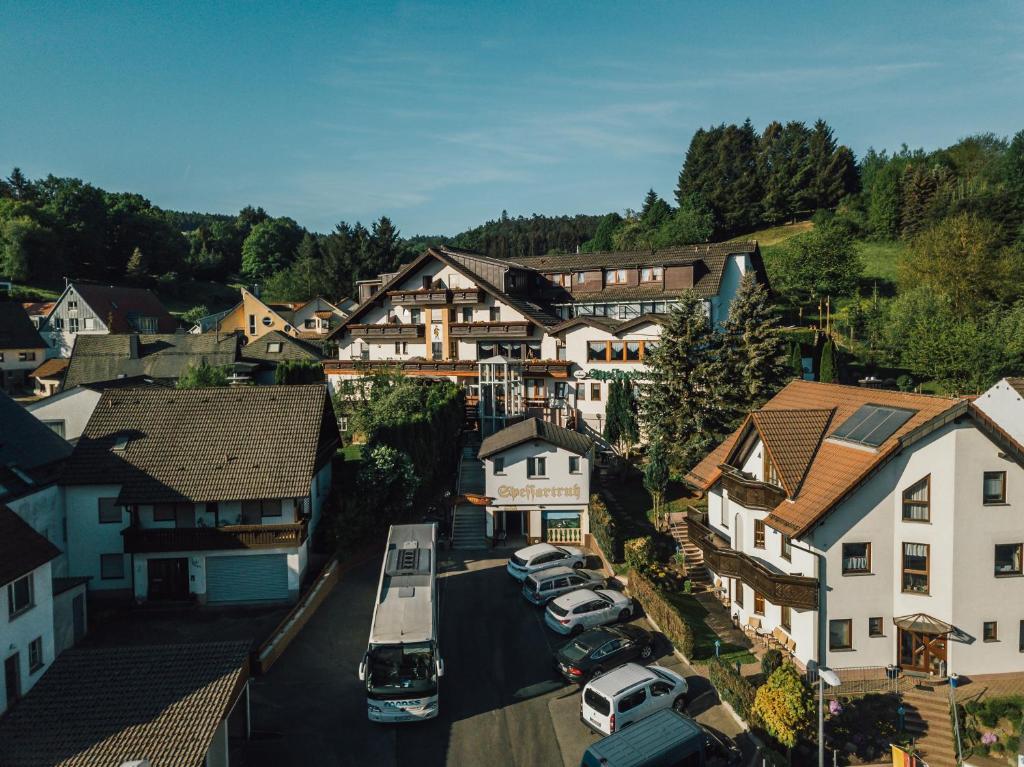 an aerial view of a village with cars parked at Landhotel Spessartruh in Frammersbach